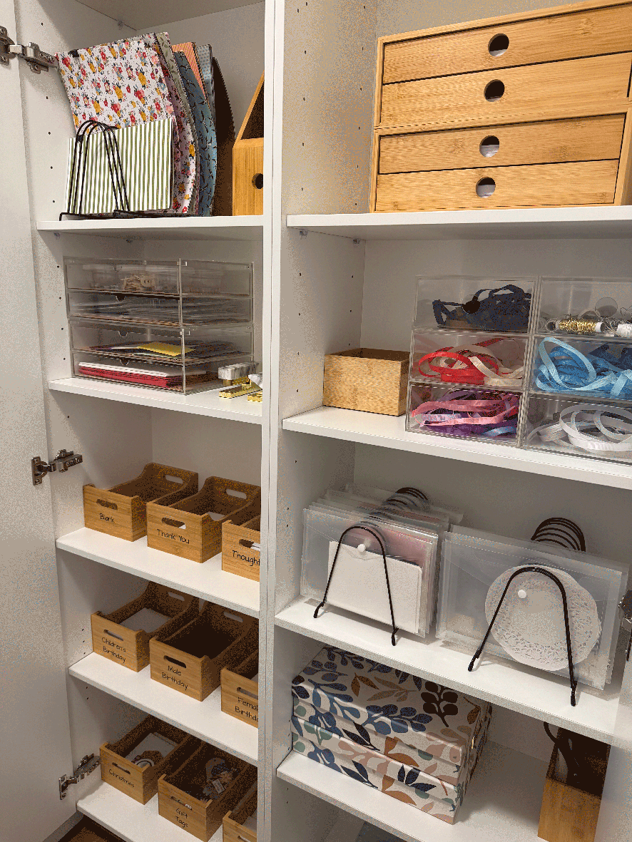Craft and stationery cabinet organised with containers and labels
